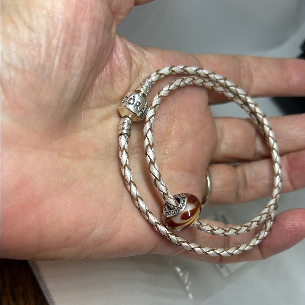 Pandora Sterling &Tan Braided Leather Bracelet with Murano glass Swirl bead.